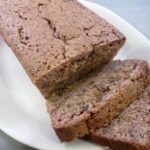 Zucchini bread with slices on a platter