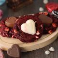 A selection of Red Velvet Sweetheart Cookies on a small wooden board