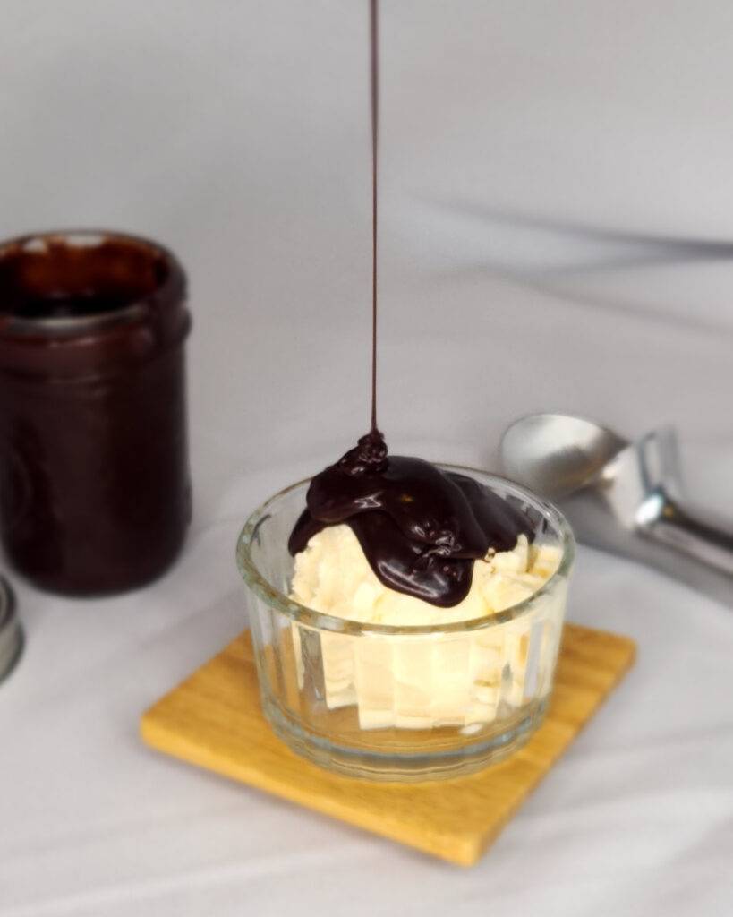 Hot fudge on vanilla ice cream