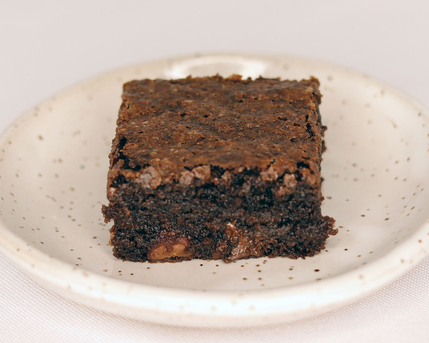 Fudgy Cocoa Brownie - top crust shows improperly dissolved sugar.