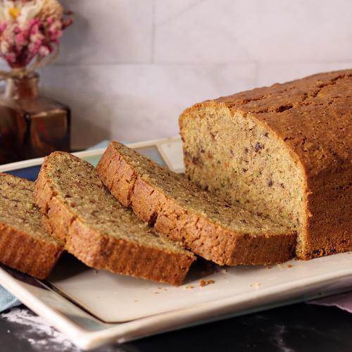 A partially sliced loaf of my Zucchini Bread
