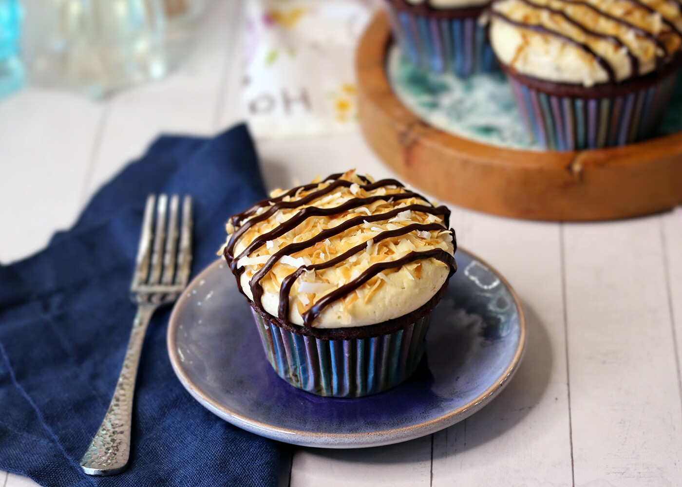 Samoa Cupcake on a small blue plate.