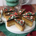 Dark Chocolate Sea Salt version of the Graham Cracker Millionaire Bars on a snowman platter