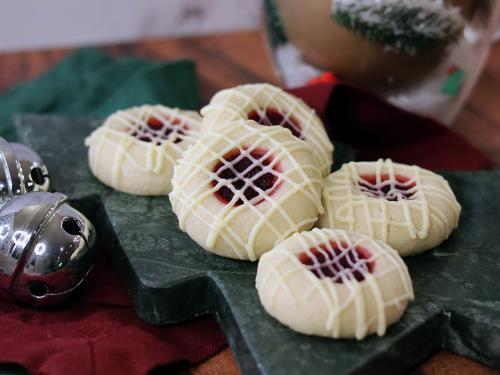 White Chocolate Cranberry Thumbprints on a Christmas tree serving board