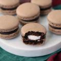 Hot Cocoa Macarons on a snowman serving board.