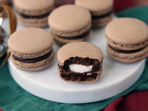 Hot Cocoa Macarons on a snowman serving board.
