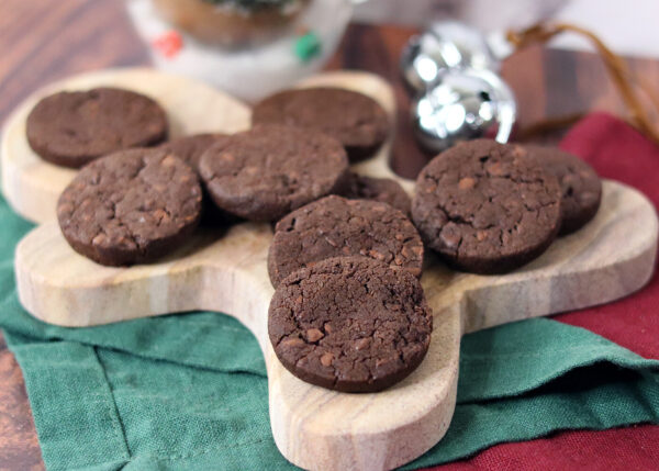 World peace cookies arranged on a gingerbread man shaped serving board.