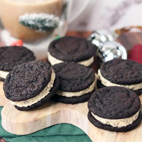 Cookies and Cream Cookie Dough Brownie Sandwiches arranged on a gingerbread man serving board