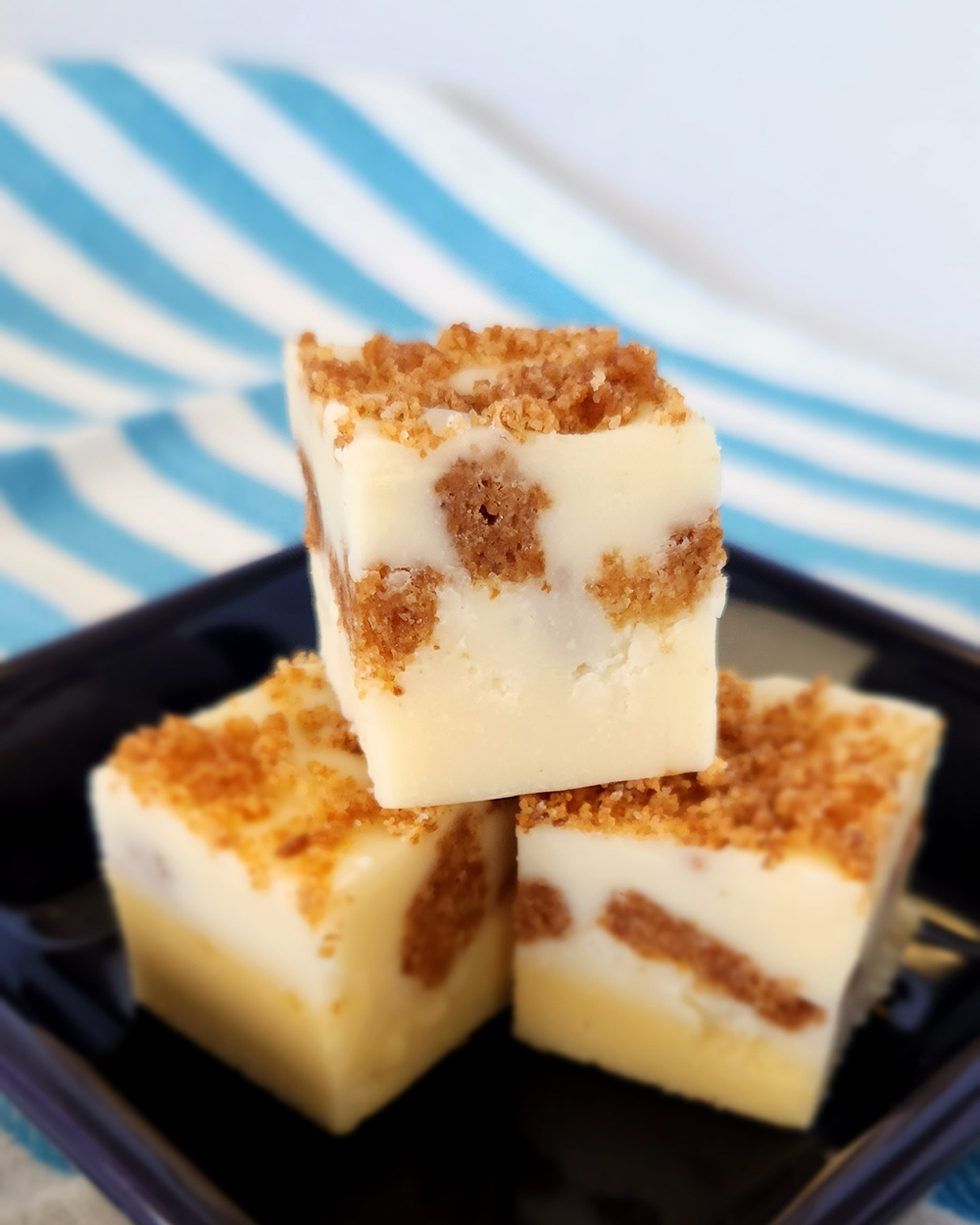 A stack of 3 pieces of New York Cheesecake Fudge