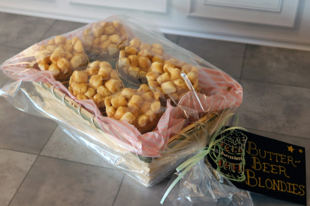 Butterbeer Blondies cut into rounds and arranged in a small basket with a decorative tag for a fair entry