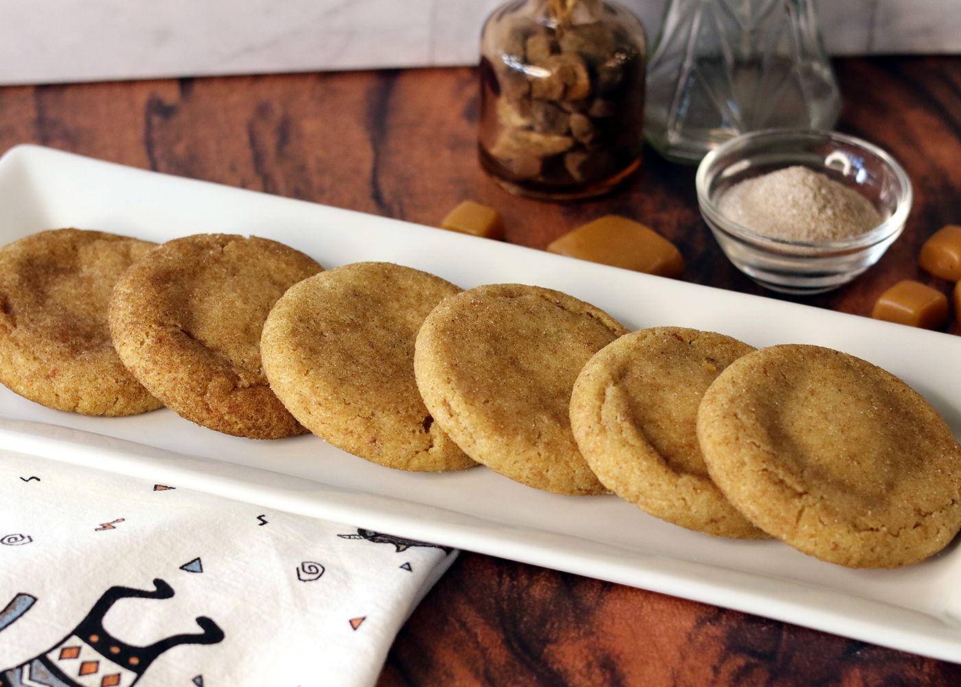 Caramel Stuffed Snickerdoodles spread on a long white platter