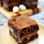 Easter Candy Brownie on a plate, more on a serving board in the background