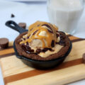 Double Chocolate Chip Cookies for Two skillet preparation with ice cream and sundae toppings.