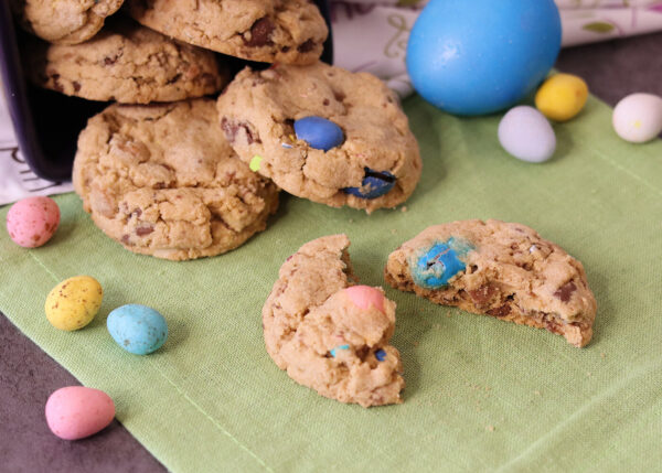 Hardboiled Egg Chocolate Chip Cookies spilling onto table. One is broken open to show interior.