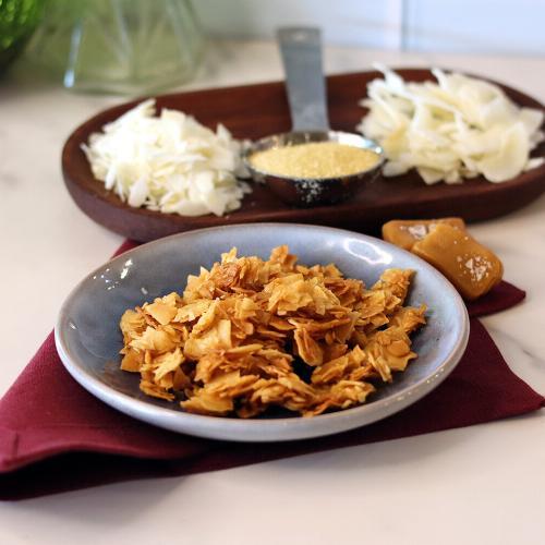 Sea Salt Caramel Coconut Chips on a small plate.