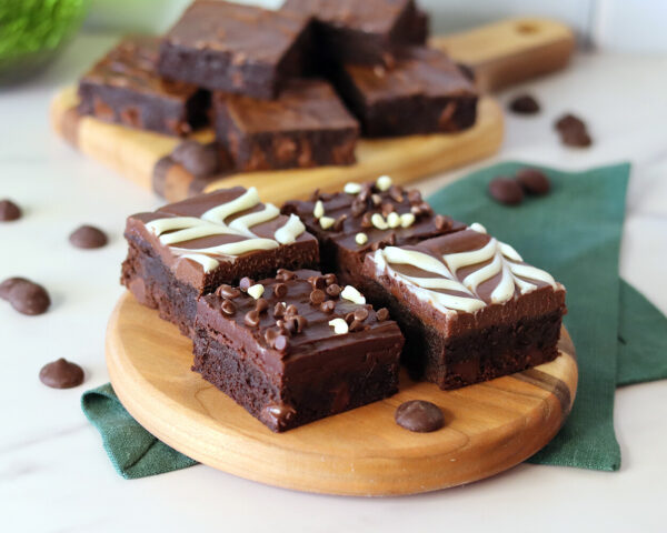Prepared DIY brownie mix brownies with a couple of different frosting options.
