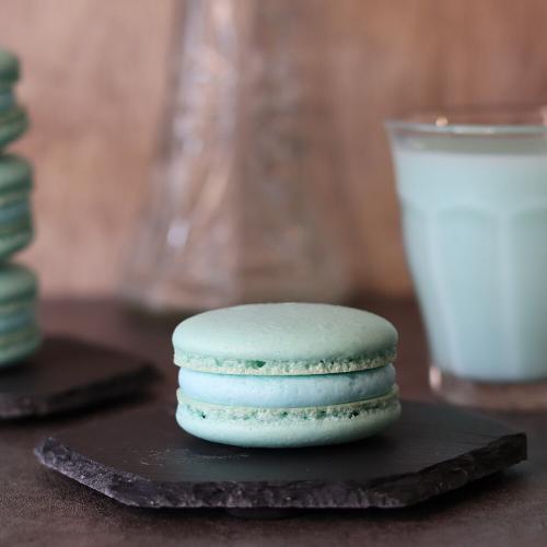 Mandalorian Macarons on hexagon plates with a glass of blue milk