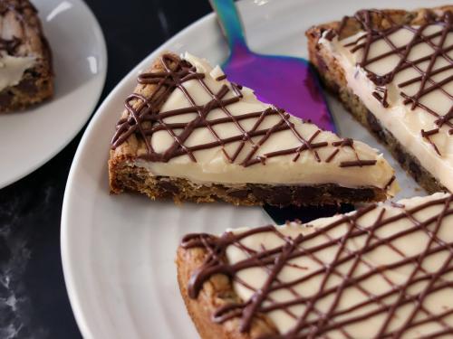 Whole Chocolate Chip Cookie Tart with a slice being served.