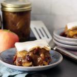 Apple squares served on a plate with vanilla glaze