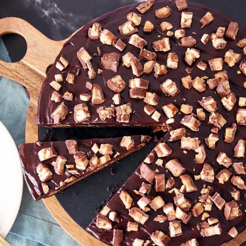Candy Bar Pie top down view with a slice separated