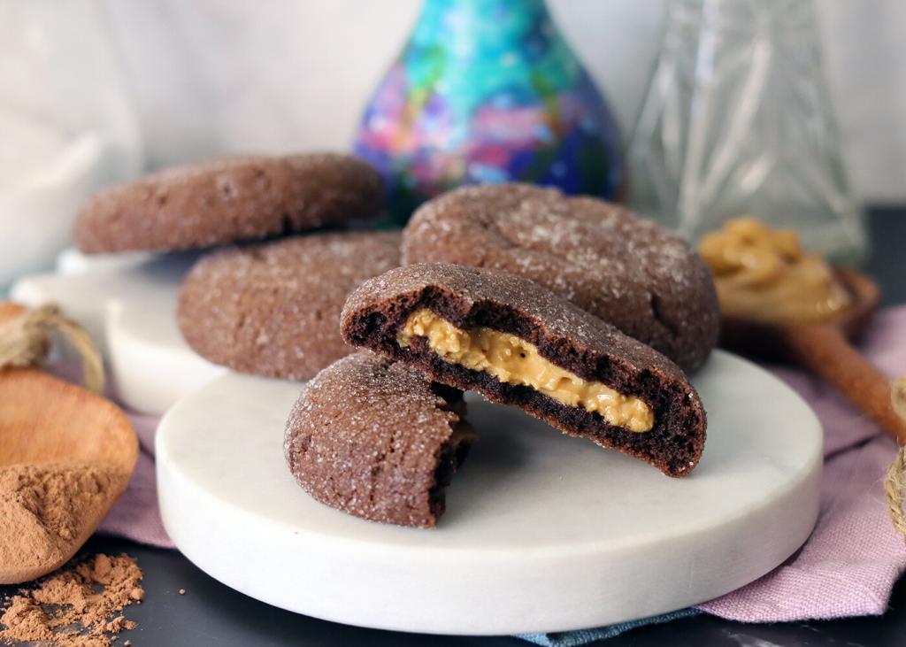 Magic in the Middle Cookies on a white marble board with one broken open