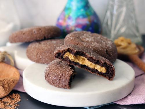 Magic in the Middle Cookies on a white marble board with one broken open