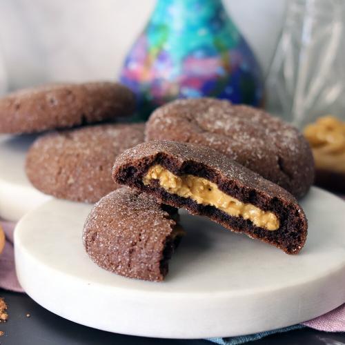 Magic in the Middle Cookies on a white marble board with one broken open