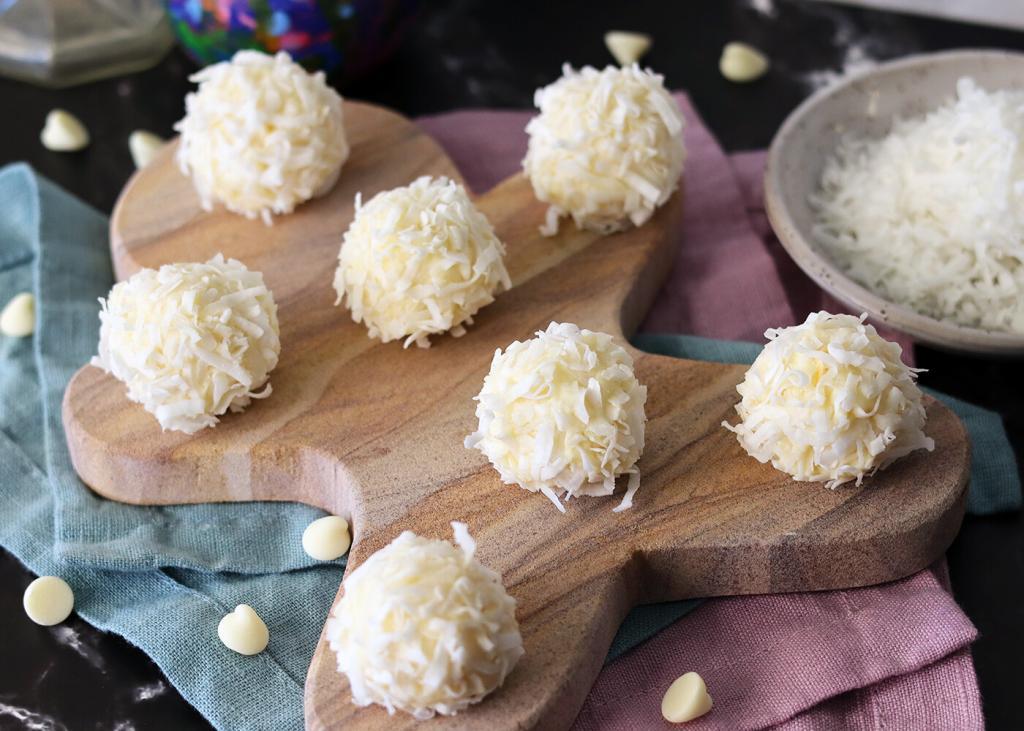 White Chocolate Coconut Snowballs on a gingerbread man serving platter