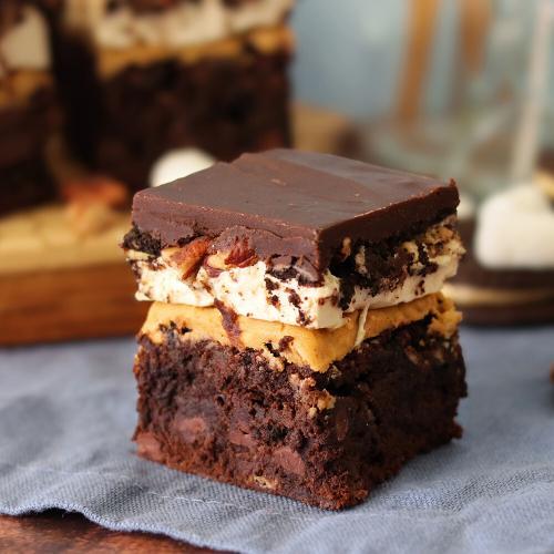 Peanut Butter Mississippi Mudpie Brownie on a blue napkin