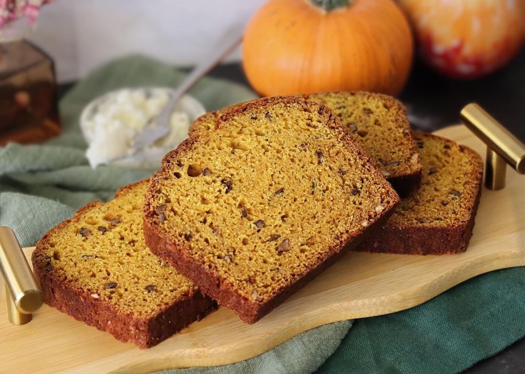 Mom's Pumpkin Bread prepared with nuts, sliced on a small serving tray