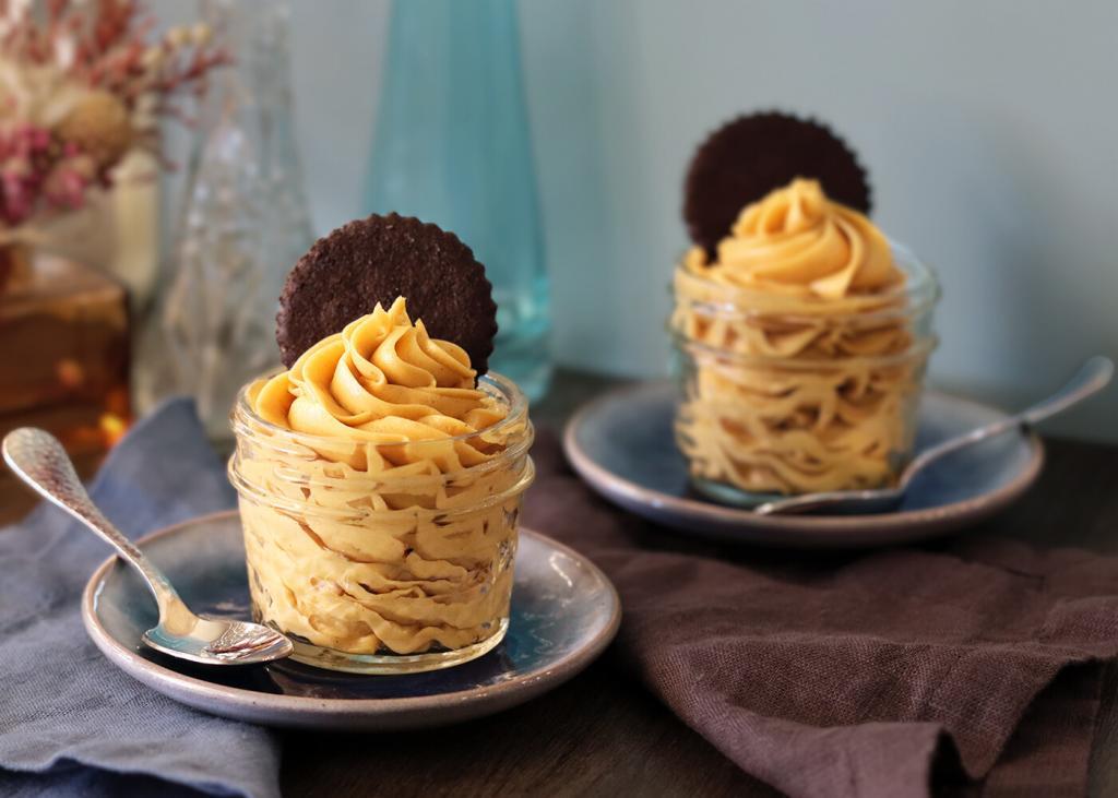 Peanut Butter Mousse served in mini mason jars with chocolate wafer cookie garnish.