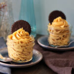 Peanut Butter Mousse served in mini mason jars with chocolate wafer cookie garnish.