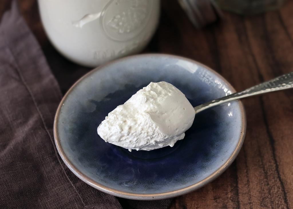 A spoonful of Marshmallow Creme on a small blue plate