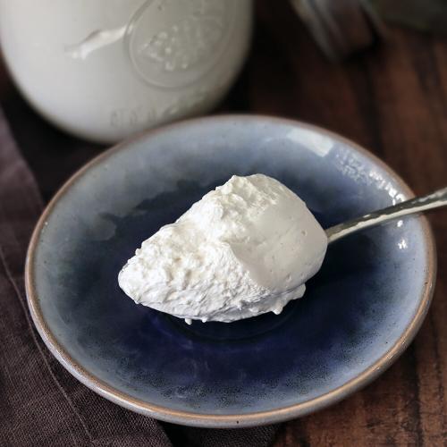 A spoonful of Marshmallow Creme on a small blue plate