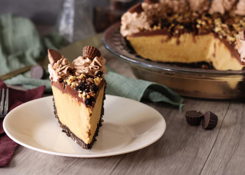 Peanut Butter Party Pie slice on a white plate with the full pie in the background