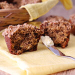 Banana Crumb Muffin cut open and waiting to be buttered.