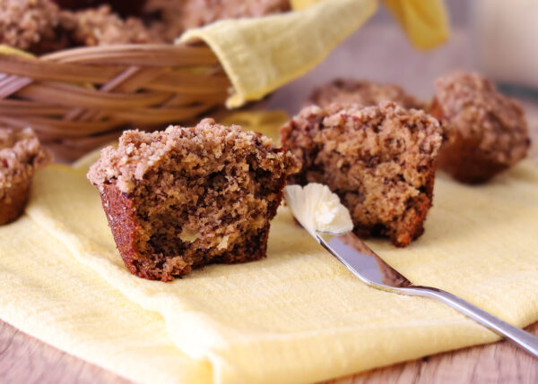 Banana Crumb Muffin cut open and waiting to be buttered.