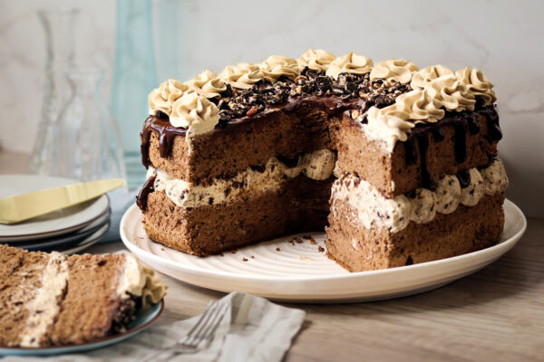 Cocoa angel food cake layered with coffee cream, Oreos, pecans and chocolate ganache