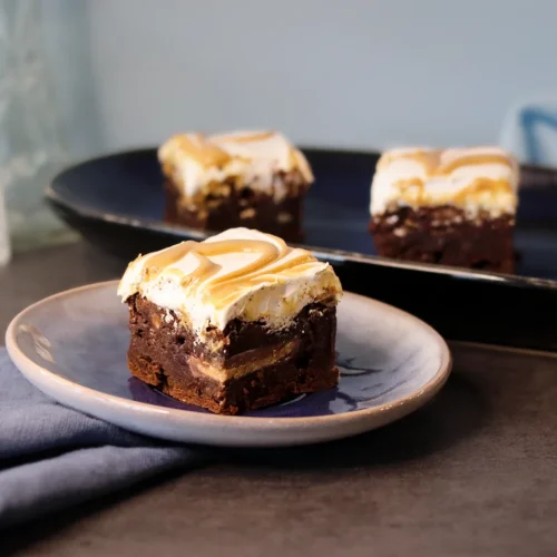 A Fluffernutter Brownie on a small plate displaying distinct layers