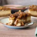 Caramel Apple Blondie Cheesecake slice with a bite removed showing the interior texture.