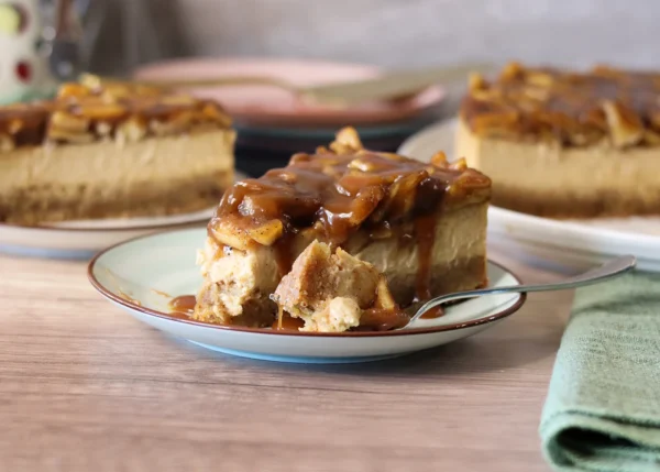 Caramel Apple Blondie Cheesecake slice with a bite removed showing the interior texture.